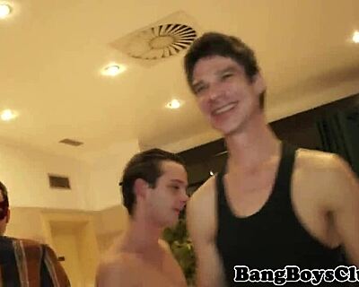Muscular twunk dominates cocksucking at wild gangbang bash